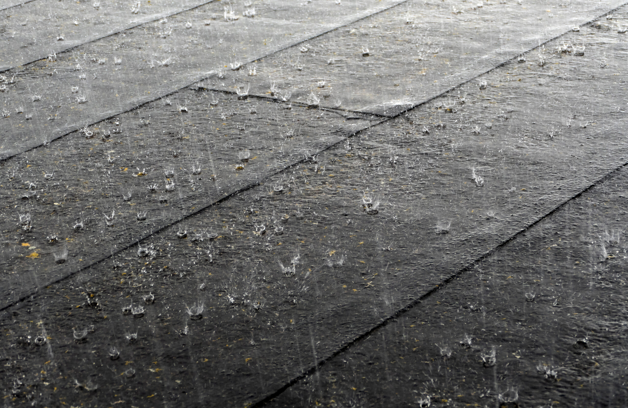 Rain hitting roof tiles